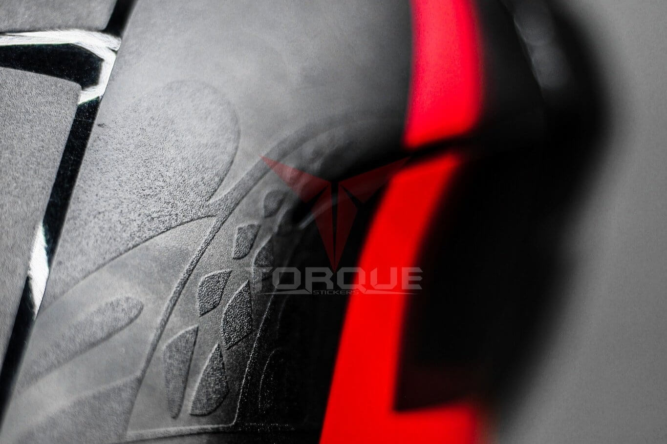 Close-up of N160 Tribal decal kit on a vehicle, showcasing intricate black design with a bold red stripe.
