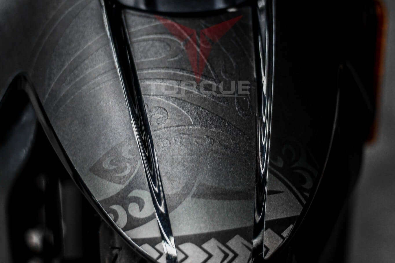 Close-up of N160 Tribal decal kit design on black surface, showcasing intricate patterns and high-quality finish.